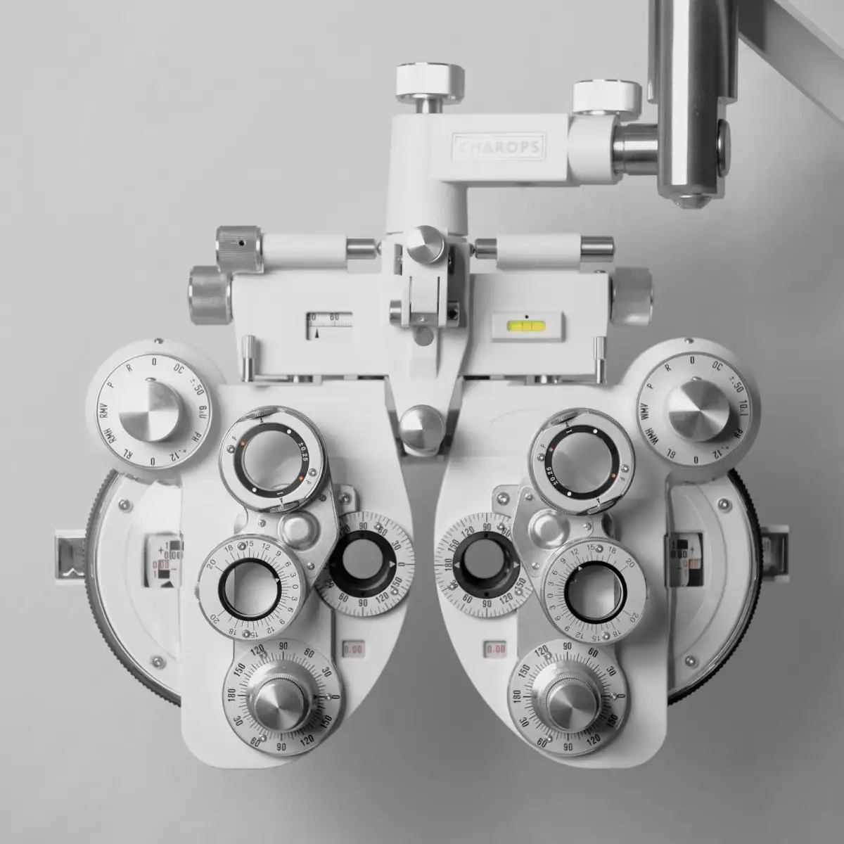A white phoropter, the lens instrument used for “better one, or two?” (stock photo)