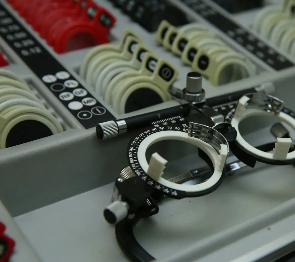A trial frame resting in a case of trial lenses (stock photo)